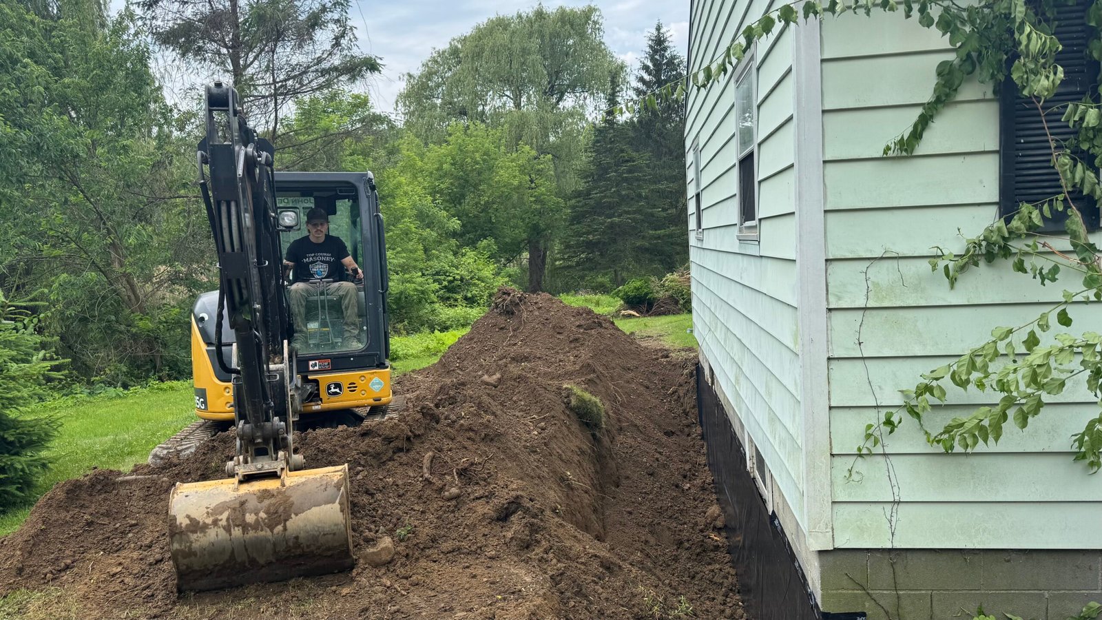 Crawl Space exterior repair being done by experts from Top Course Masonry