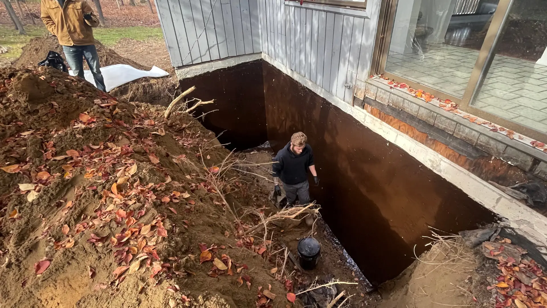 Top Course Masonry expert during a final inspection after a basement waterproofing service